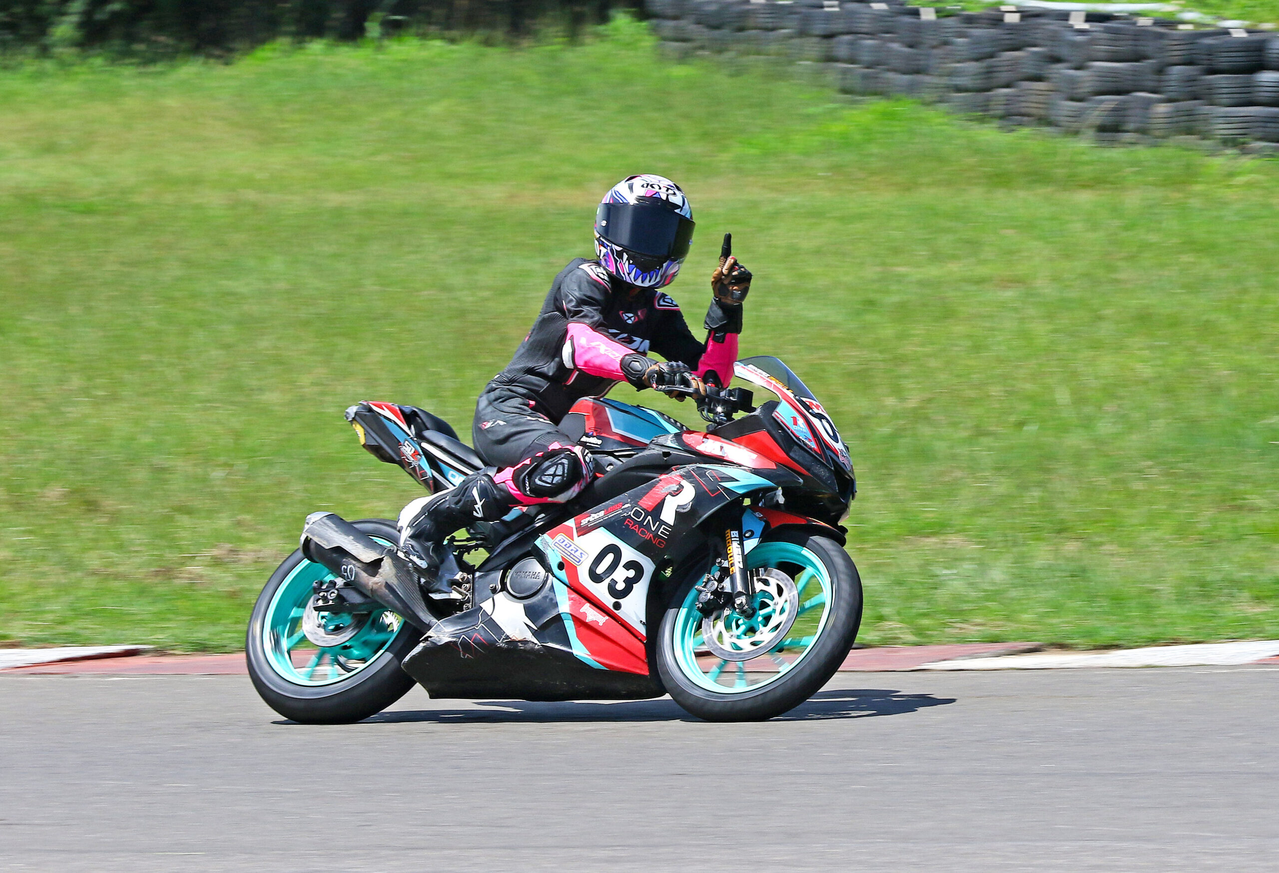 Jagathishree Kumaresan celebrating her victory in the Girls (Stock 165cc) race (Oct 4)