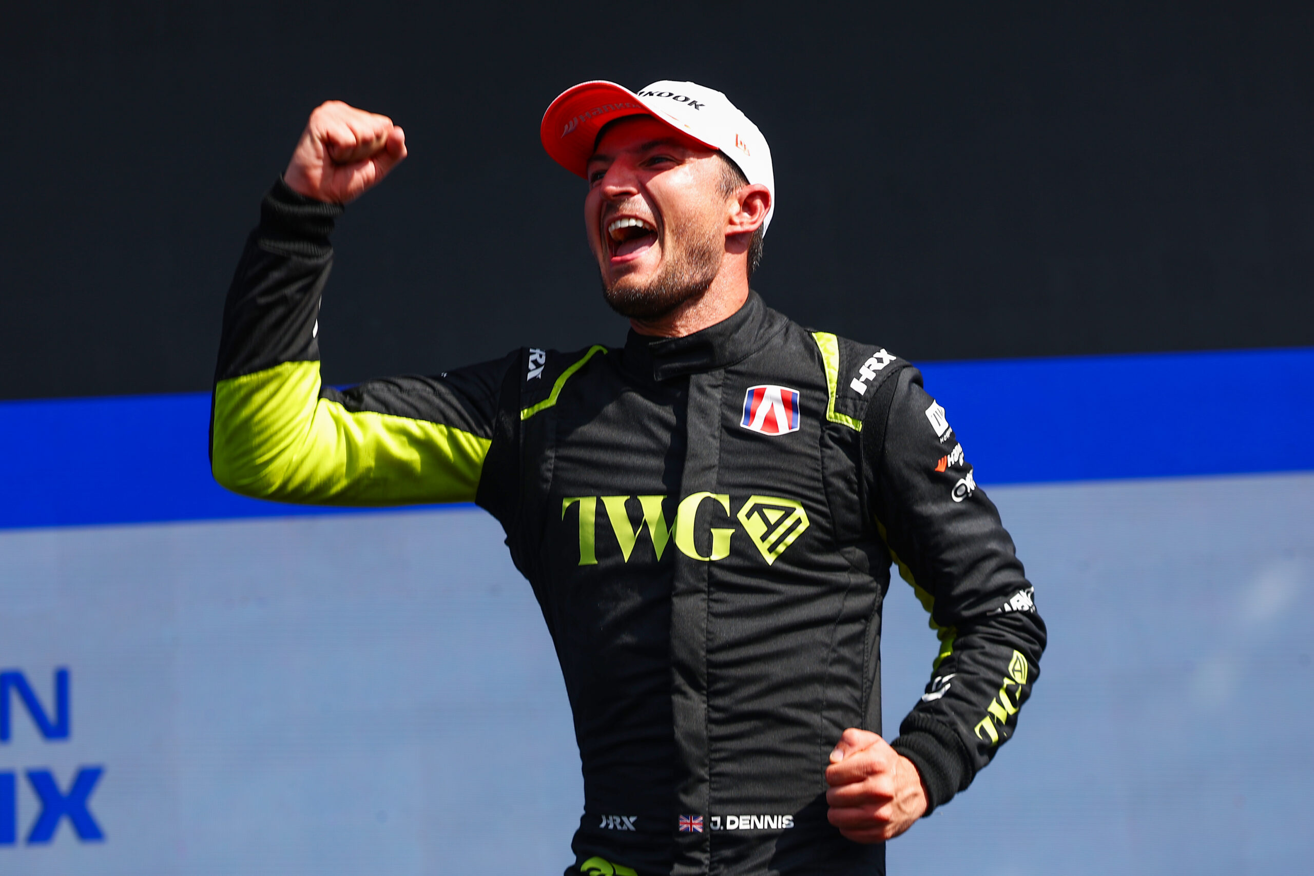 SANYA, CHINA - JUNE 20: Race winner Jake Dennis of Great Britain and Andretti Formula E celebrates on the podium during the Sanya E-Prix, Round 11 of the 2026 FIA Formula E World Championship at Sanya Street Circuit on June 20, 2026 in Sanya, China. (Photo by Joe Portlock/LAT Images)