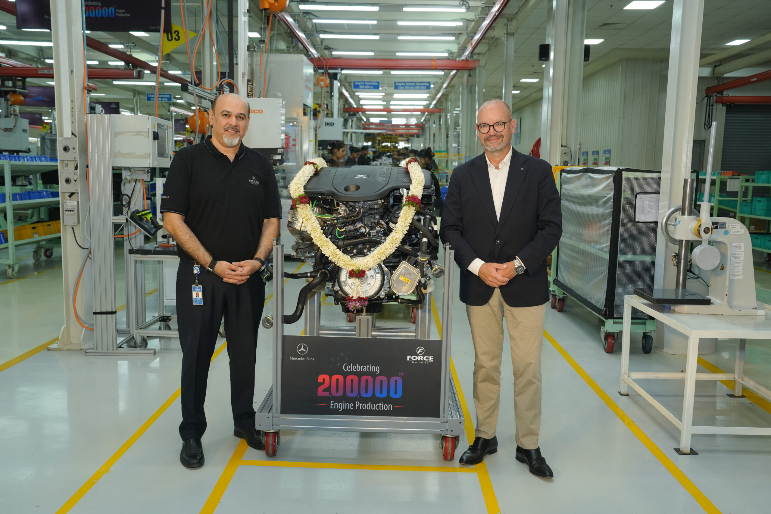 Mr. Prasan Firodia and Dr. Joerg Burzer with the 200000th Mercedes-Benz Engine Roll-out