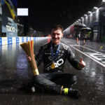 TOKYO, JAPAN - JULY 25: Race winner Dan Ticktum of Great Britain and CUPRA KIRO poses for a photo in rain while sitting in the Pitlane with his trophy during the Tokyo E-Prix, Round 14 of the 2026 FIA Formula E World Championship at Tokyo Street Circuit on July 25, 2026 in Tokyo, Japan. (Photo by Simon Galloway/LAT Images)