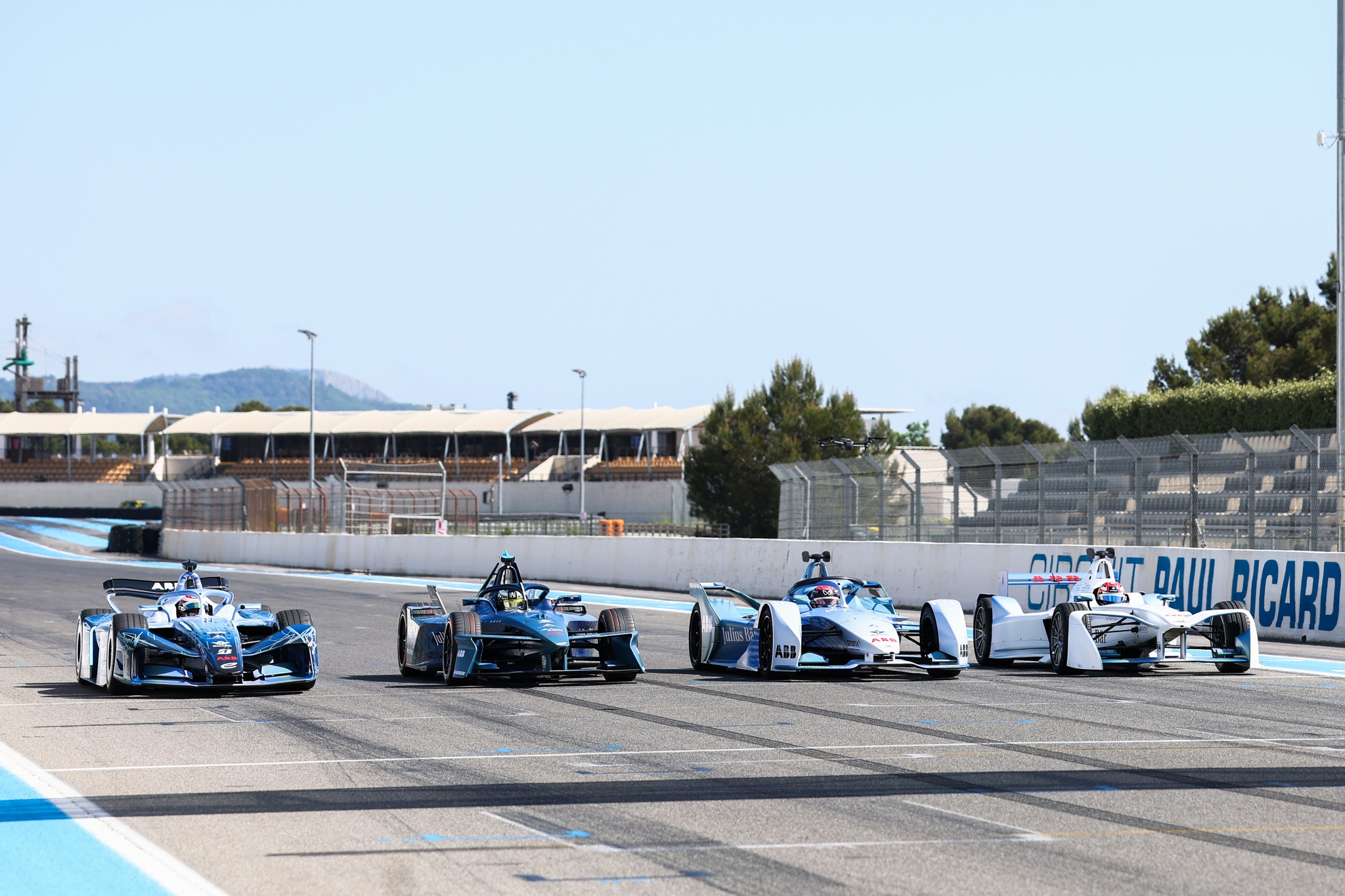 LE CASTELLET, FRANCE - APRIL 21: James Rossiter of Great Britain driving the GEN4 Formula E car, Jake Dennis of Great Britain driving the GEN3 Formula E car, Nyck de Vries of the Netherlands driving the GEN2 Formula E car, and Sebastien Buemi of Switzerland driving the GEN1 Formula E car, line up on the grid during the Formula E GEN4 Launch at Circuit Paul Ricard on April 21, 2026 in Le Castellet, France. (Photo by Simon Galloway/LAT Images)