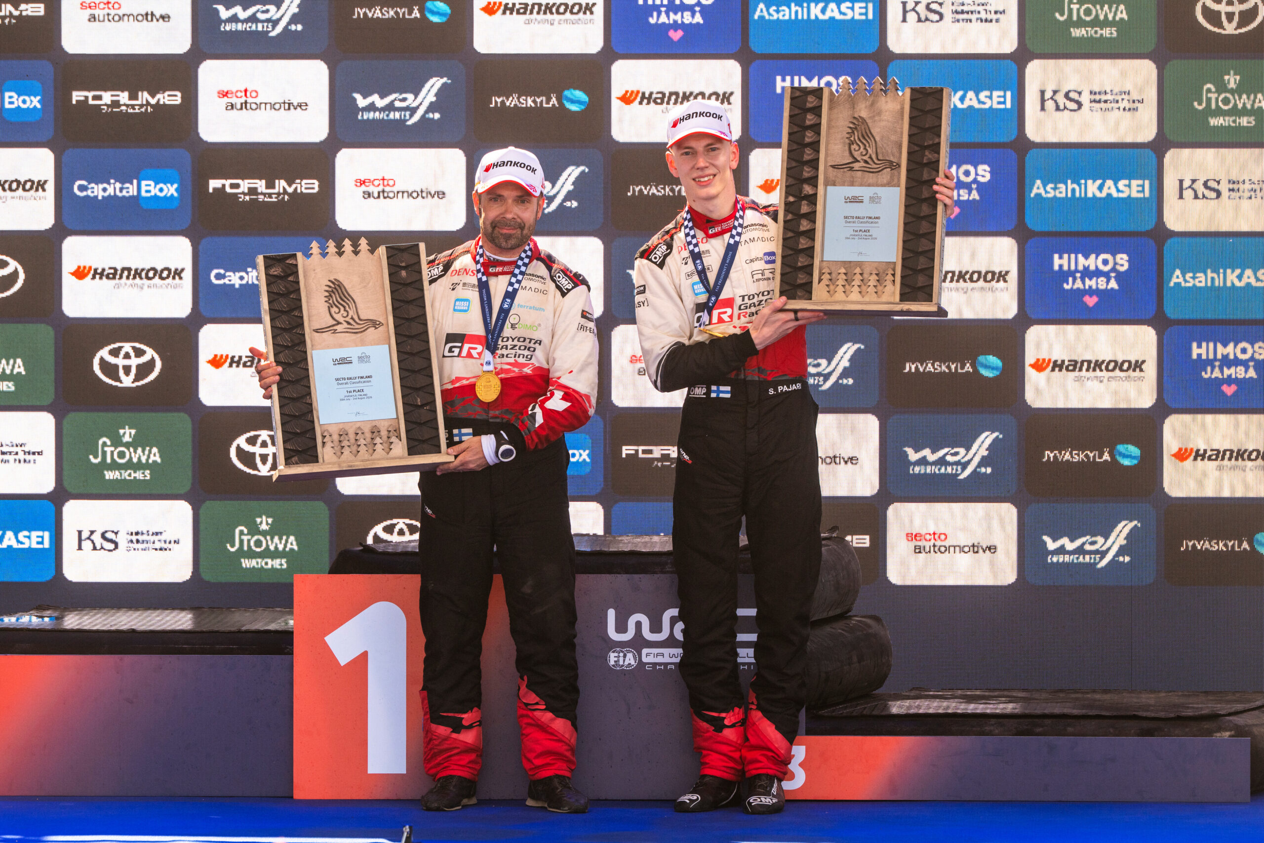 Sami Pajari (FIN), Marko Salminen (FIN) Of team TOYOTA GAZOO RACING WRT2 celebrate on the podium in first place after winning the WRC Rally1 category at Secto Rally Finland in Jyväskylä, Finland on 02.08.2026. // Jaanus Ree / Red Bull Content Pool // SI202608020181 // Usage for editorial use only //