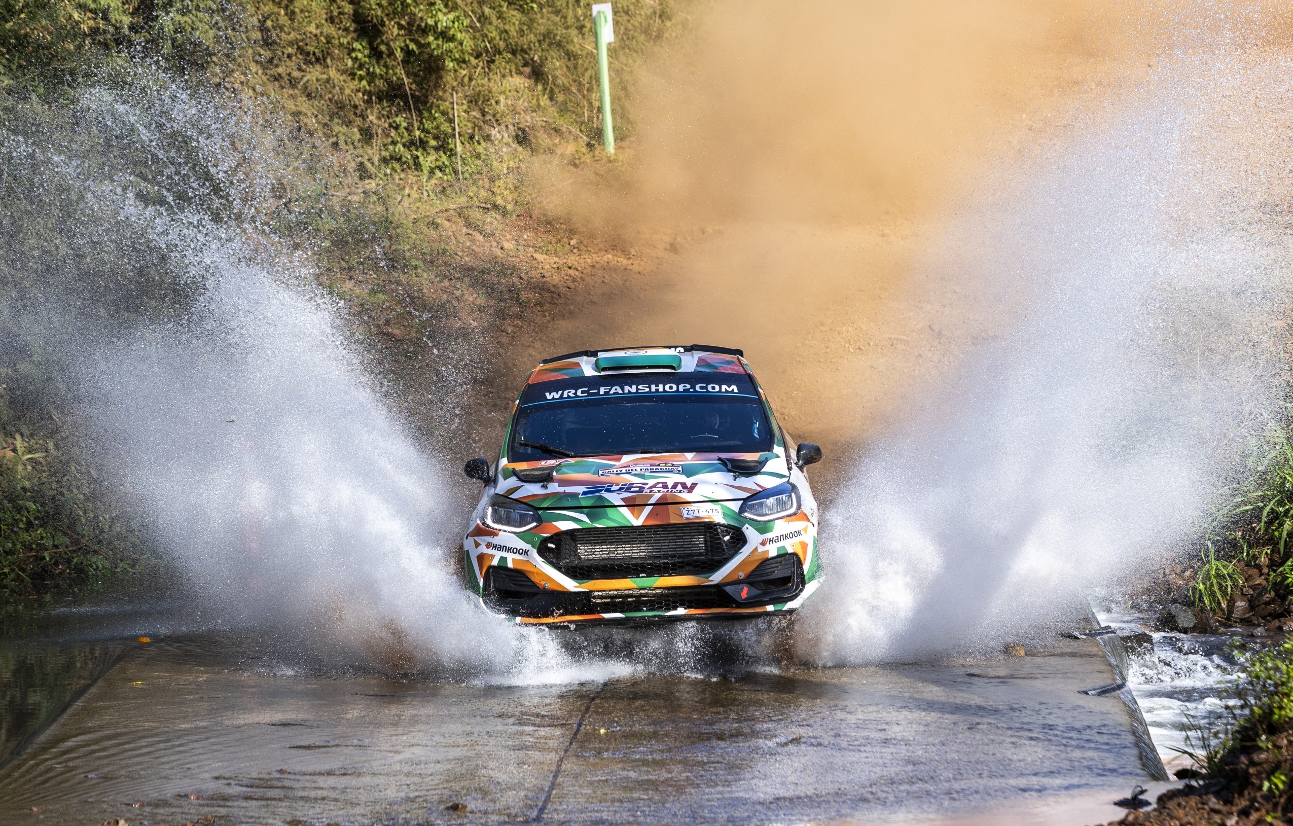 Naveen Puligilla and Musa Sherif cross a water body at Paraguay Rally on Sunday.